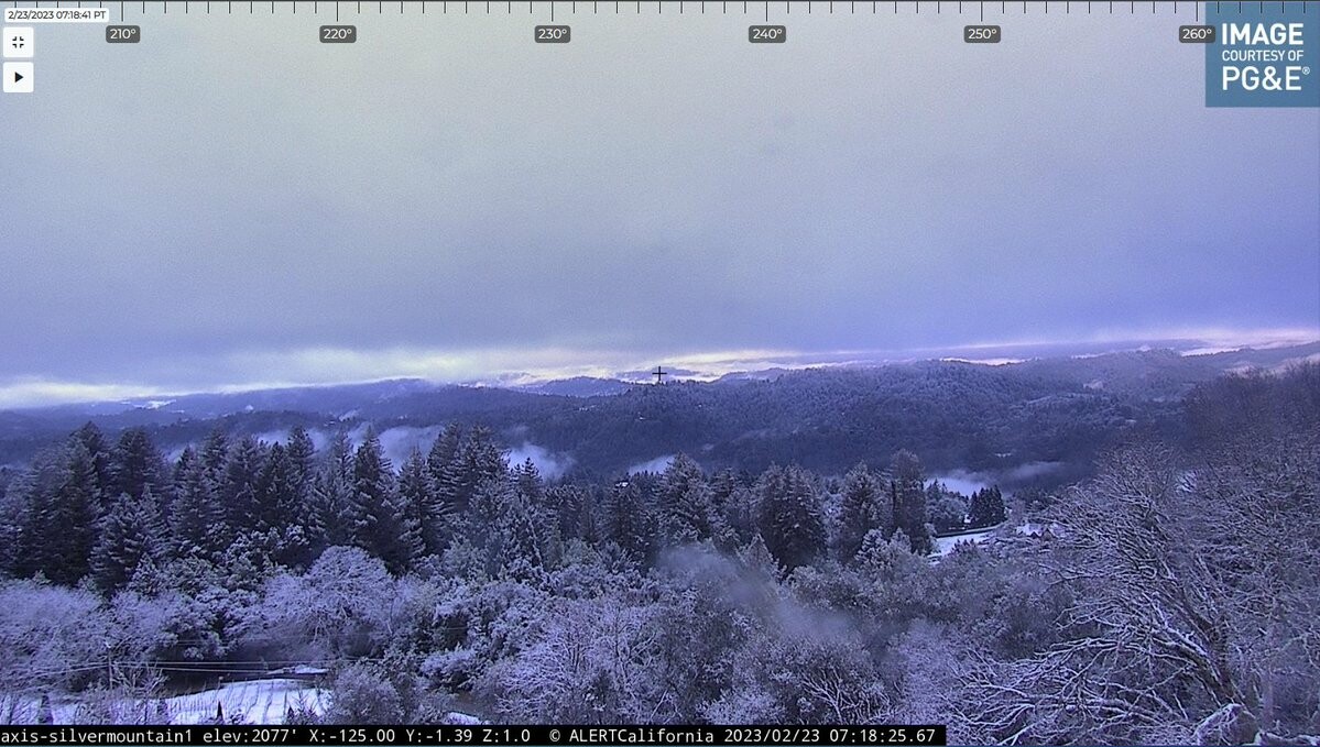 Webcam image in the Santa Cruz Mountains facing southwest. This image shows snow dusting of snow on the ground as well as snow sticking to the trees. Elevation of the image is approximately 2000 feet.