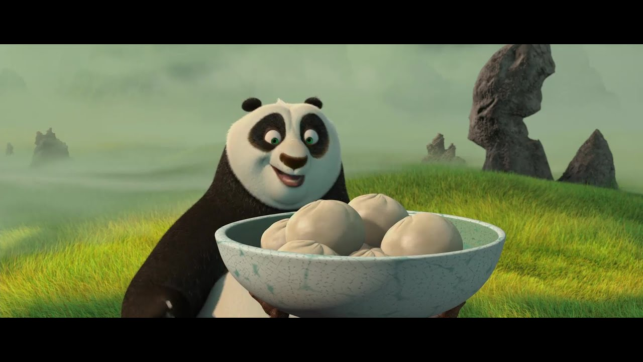 Po looking excitably at bowl of dumplings held by Shifu during training